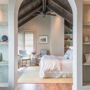 Arched Bedroom Doorway flanked by Built In Bookcases