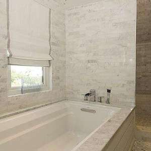 Arched Shower with Marble Tiles