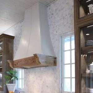 White Range hood with Marble Triangle Backsplash Tiles